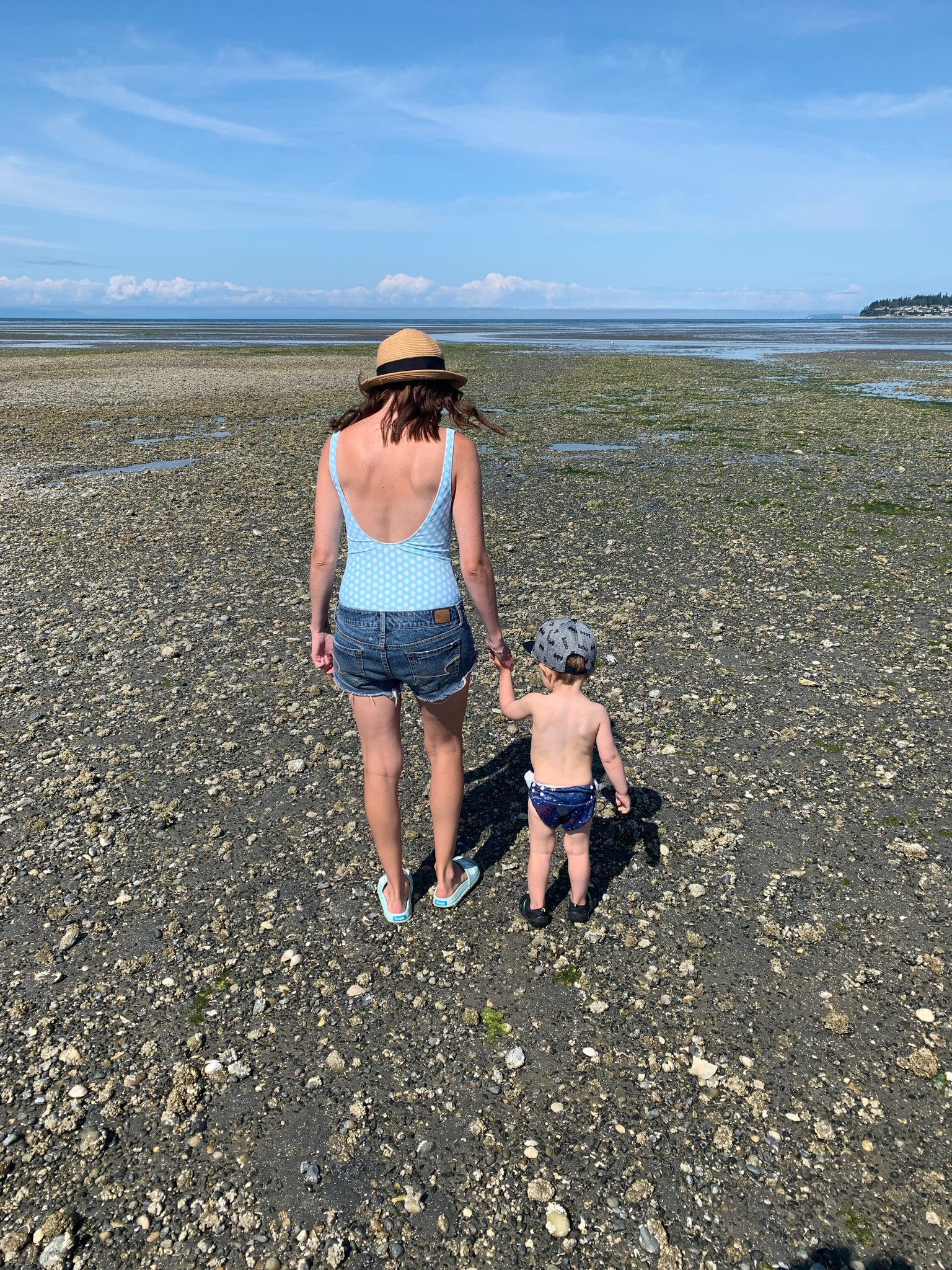 Woman and child enjoying a beach stroll