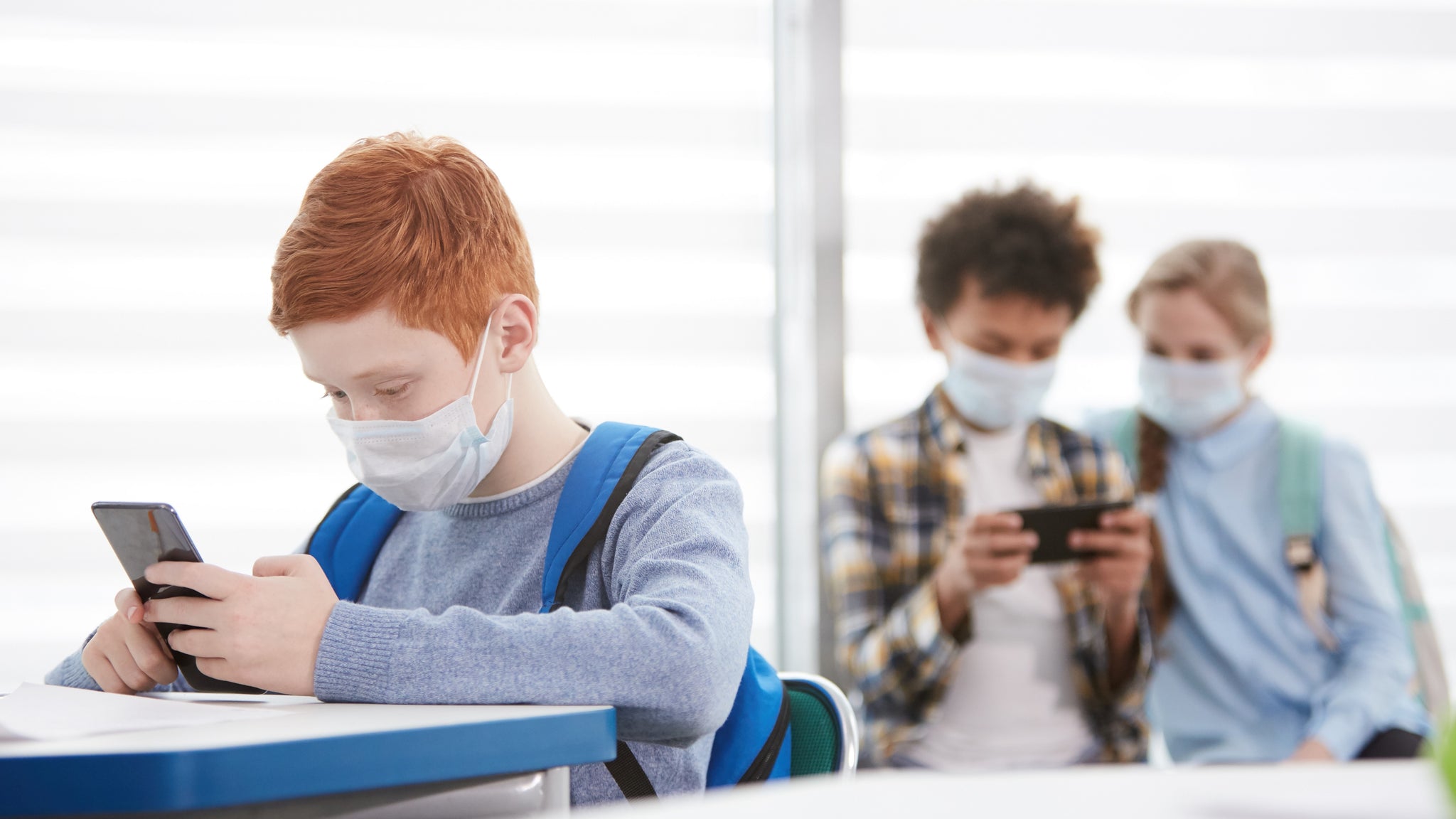 Children holds mobile phones