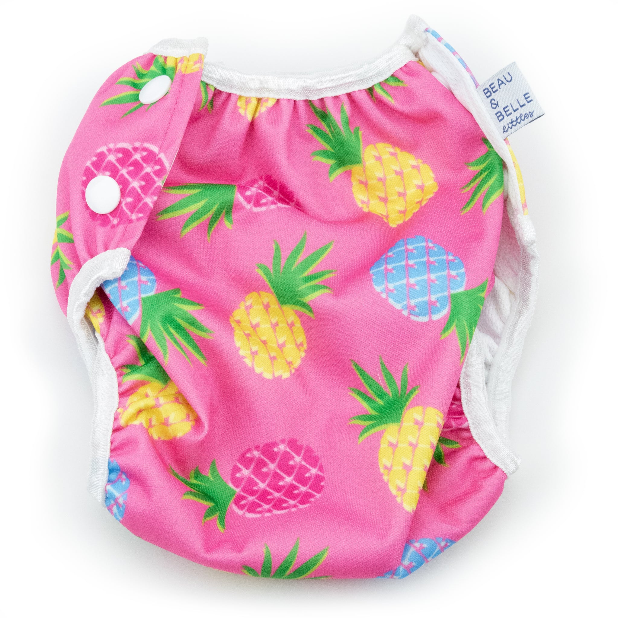 Beau and Belle Littles Swim Diaper, Regular Size, light pink background with yellow, dark pink, and blue pineapples, flat lay, back view