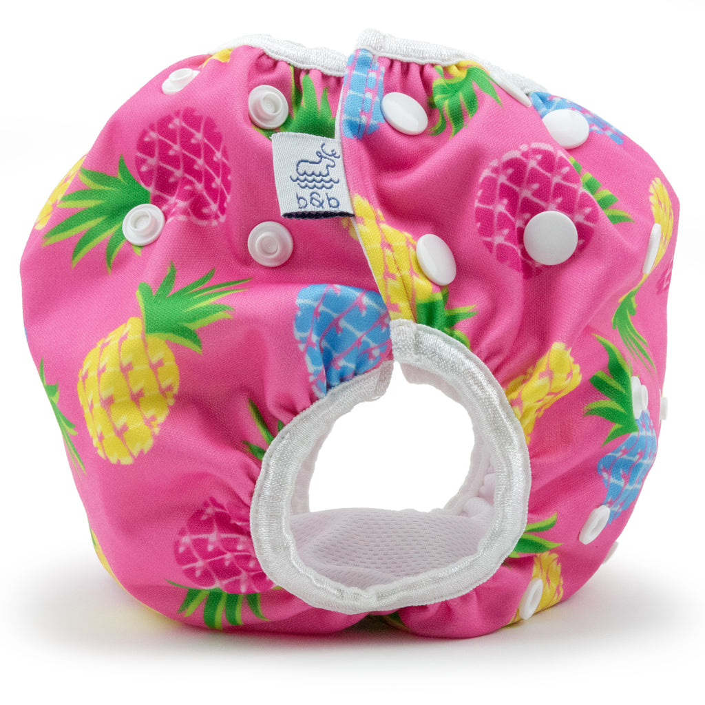 Beau and Belle Littles Swim Diaper, Regular Size, light pink background with yellow, dark pink, and blue pineapples, side view