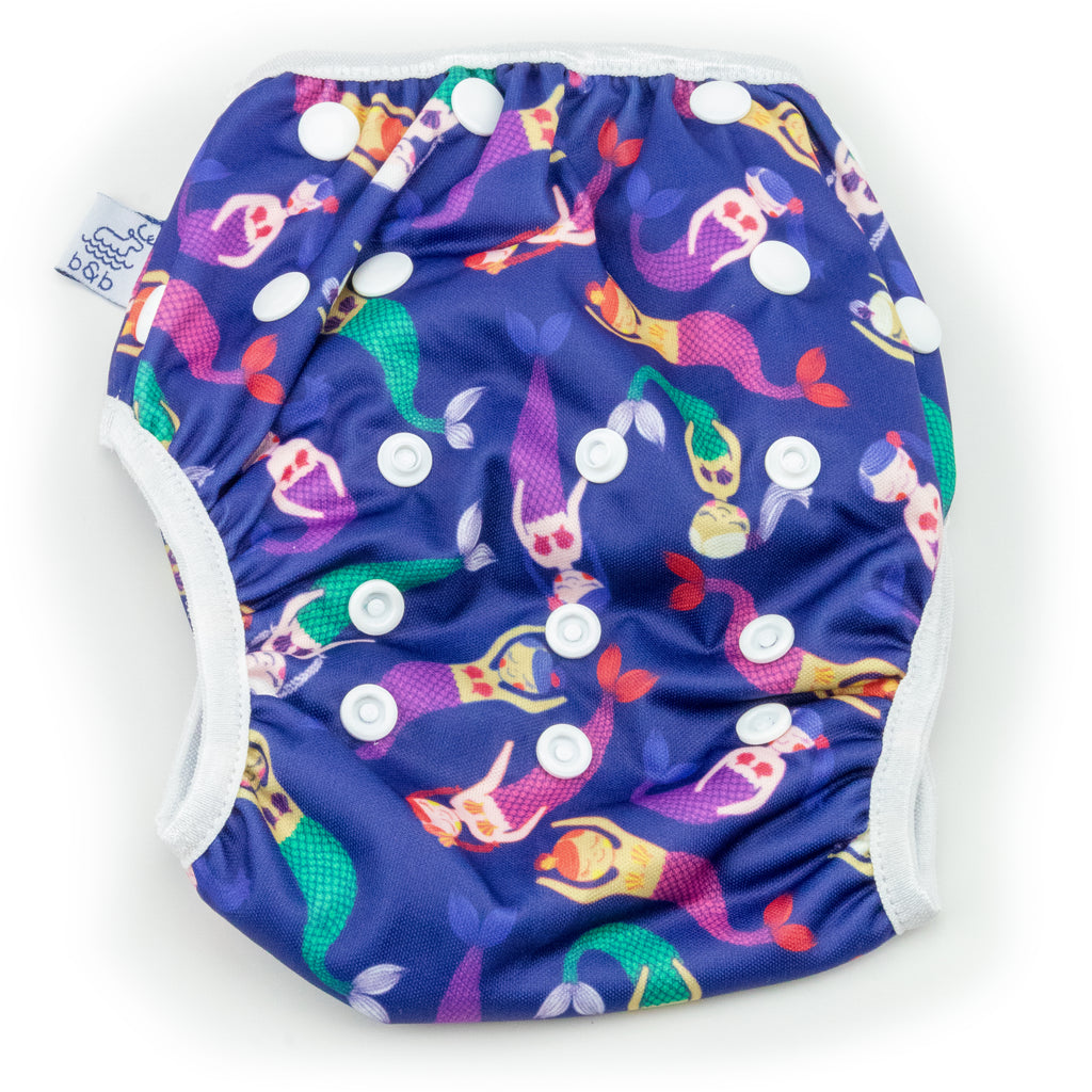 Beau and Belle Littles Swim Diaper, Regular Size, dark purple with mermaids, flat lay, front view