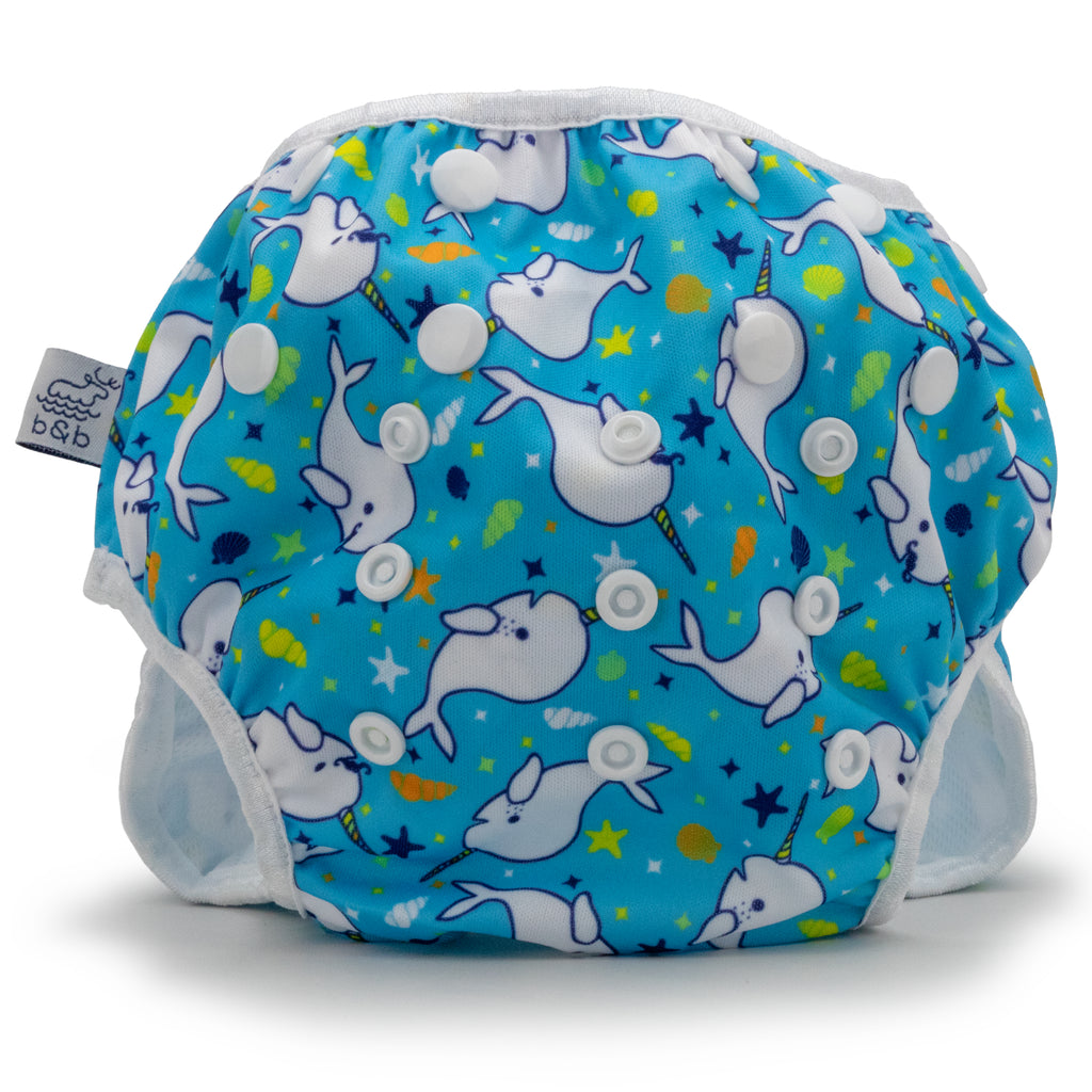Reusable swim diaper with blue narhwal design, front view, large size.