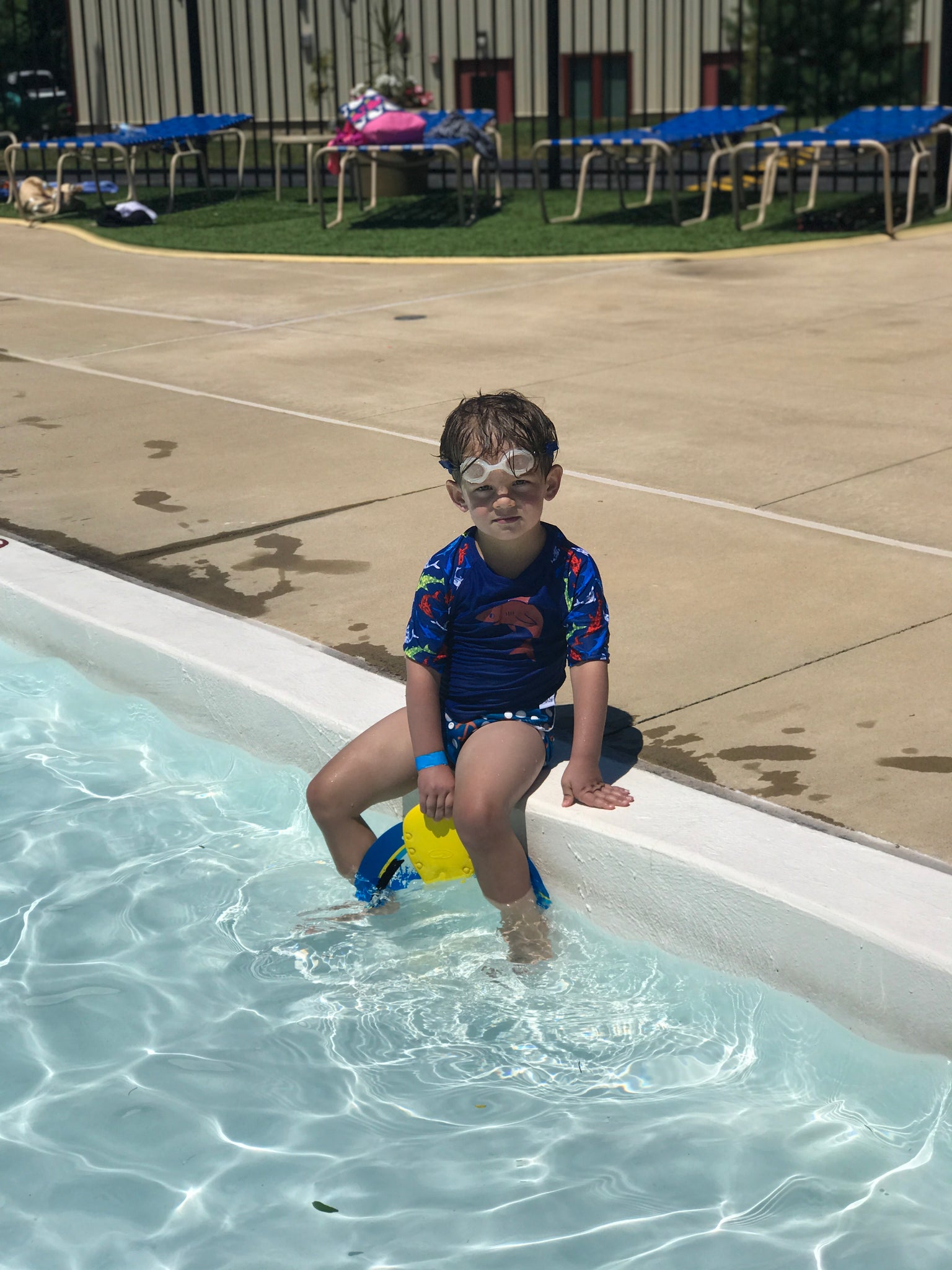 boy sitting on the edge of a pool wearing a Beau and Belle Littles Rash Guard/Swim Shirt, dark blue with lighter blue 3/4 sleeves, shark print and matching swim diaper