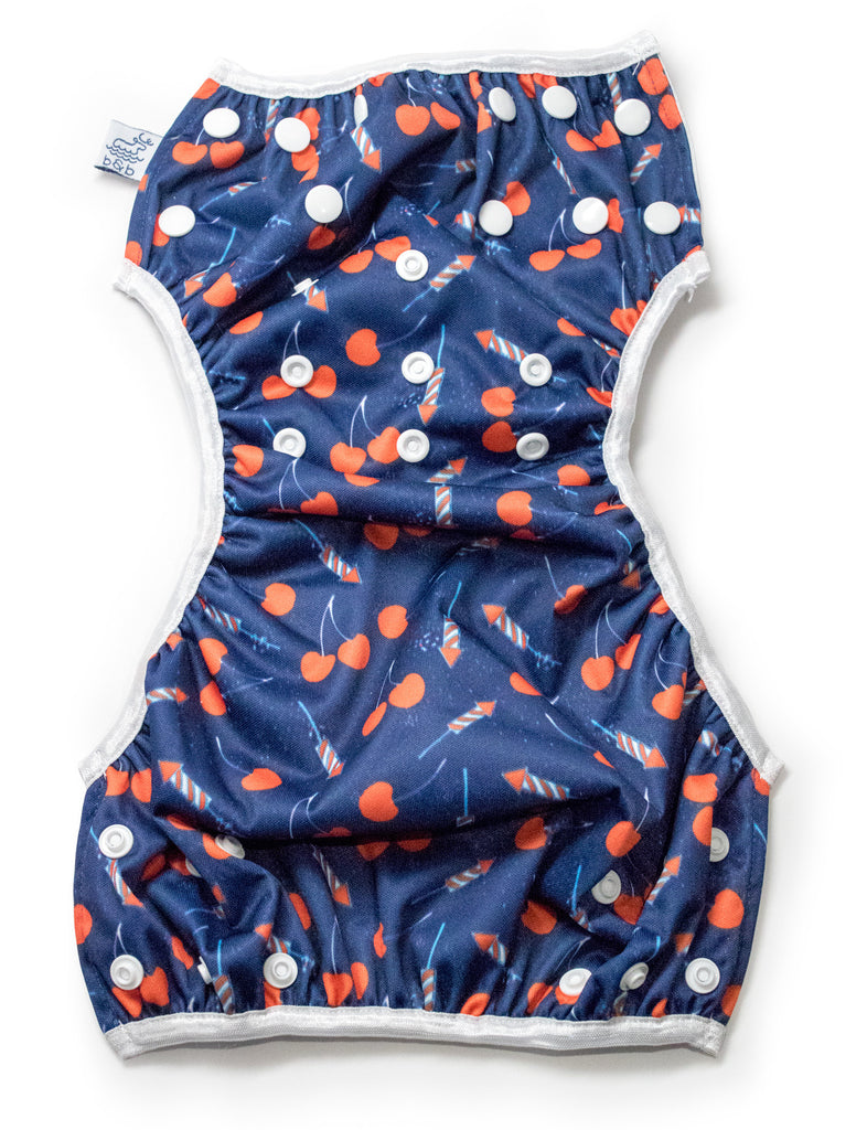 Beau and Belle Littles Swim Diaper, Regular Size, Lauren Holiday Cherry bomb print, unbuttoned and laid out flat